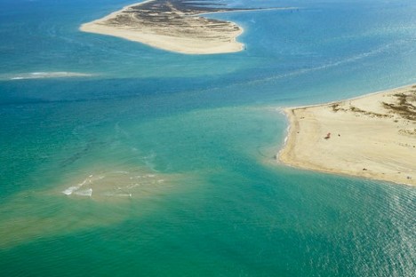 a body of water next to the ocean
