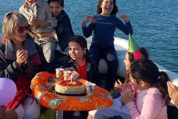a group of people on a boat in the water