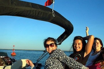 a couple of people that are standing in a body of water