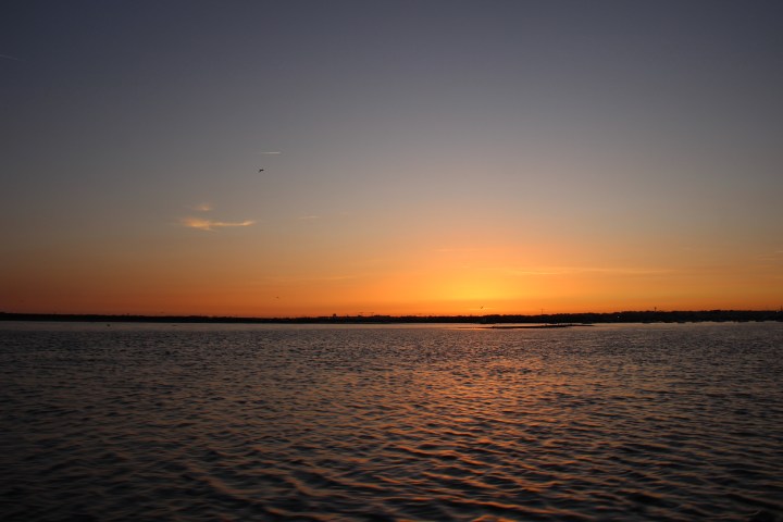 a sunset over a body of water